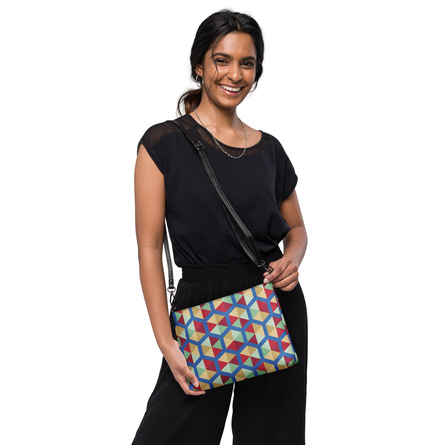 Crossbody bag with multicolor geometric cube pattern in red, yellow and blue.