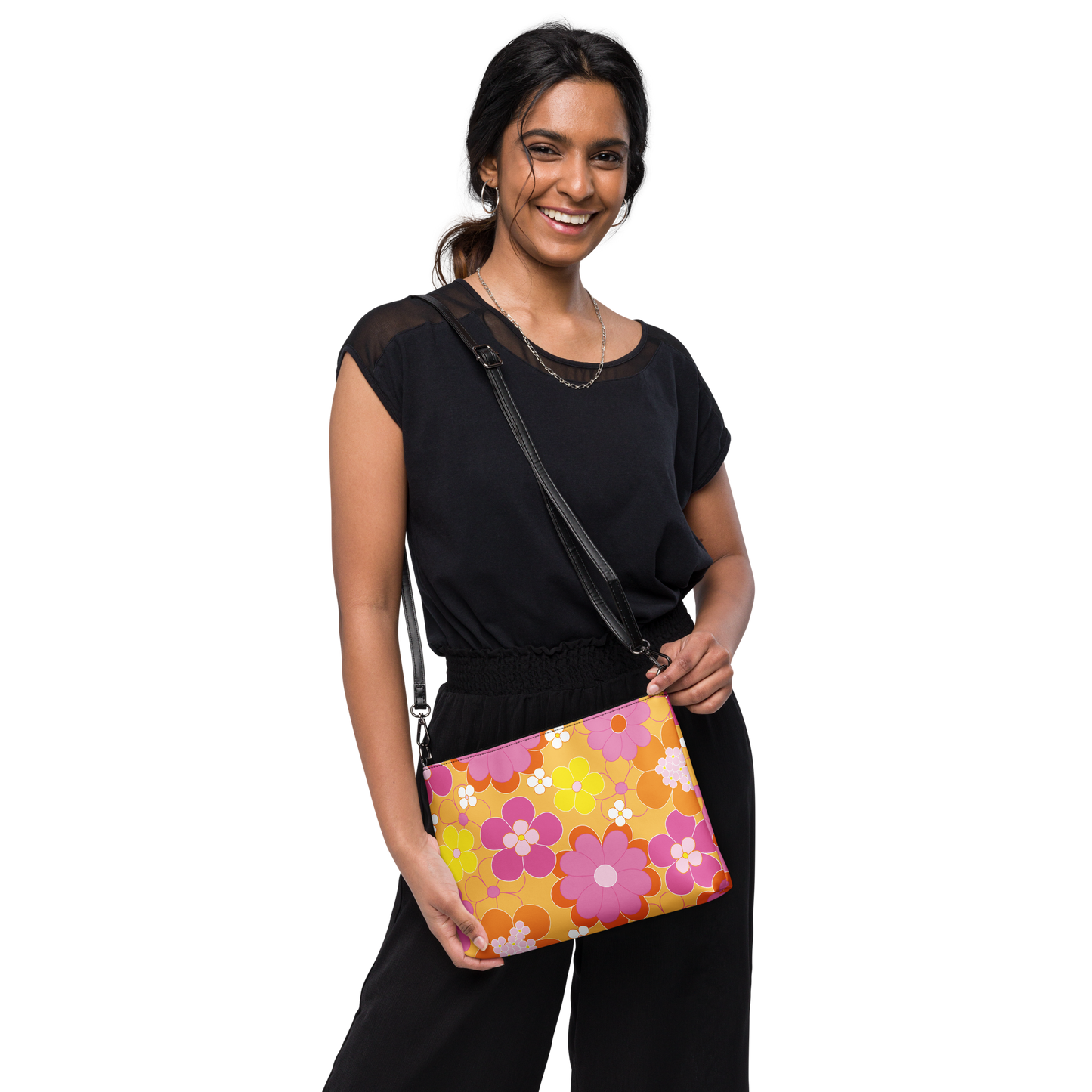 Floral crossbody bag with yellow, orange, and pink flowers on a vibrant background.