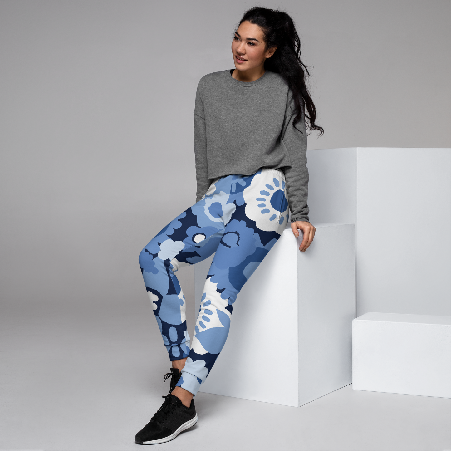 Women's joggers with oversized blue and white floral pattern.