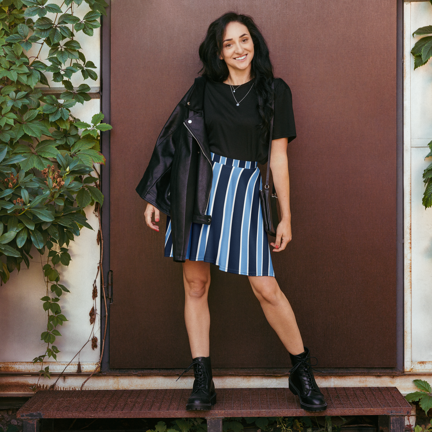 Navy and white striped skater skirt with flowing silhouette and elastic waistband.