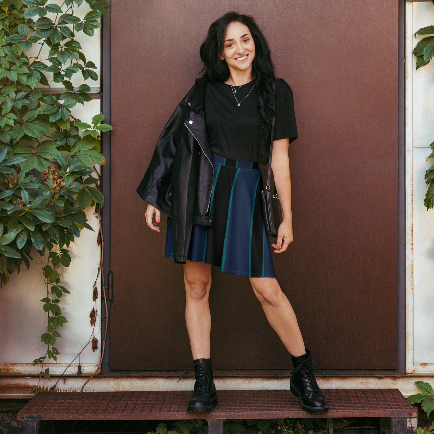 Deep blue skater skirt with teal vertical stripe pattern design.