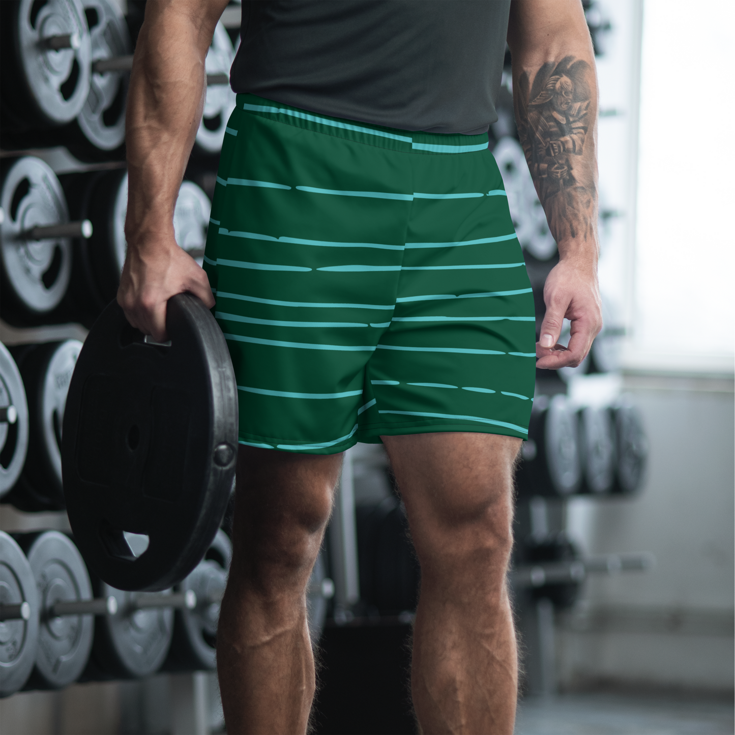 Green athletic shorts with horizontal light green lines and elastic waistband.