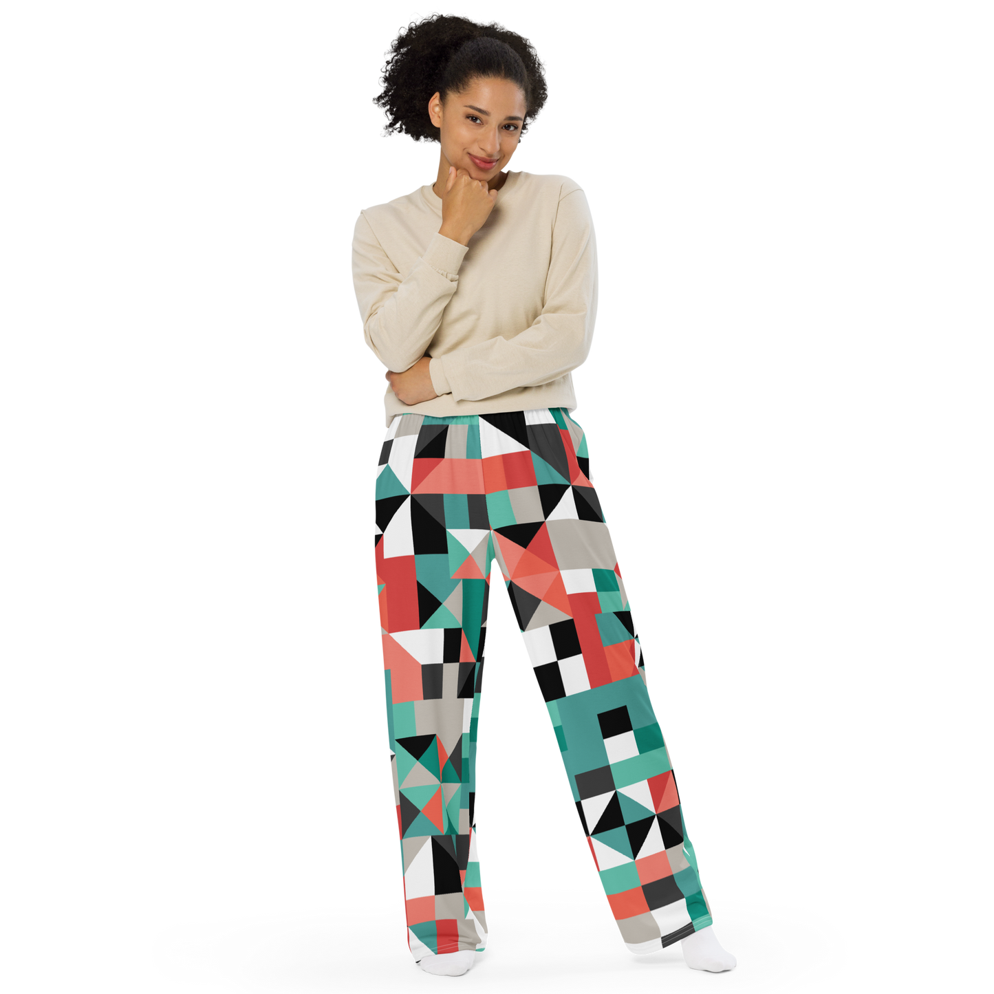 Women's wide-leg pants with teal, red, gray, black, and white geometric pattern.
