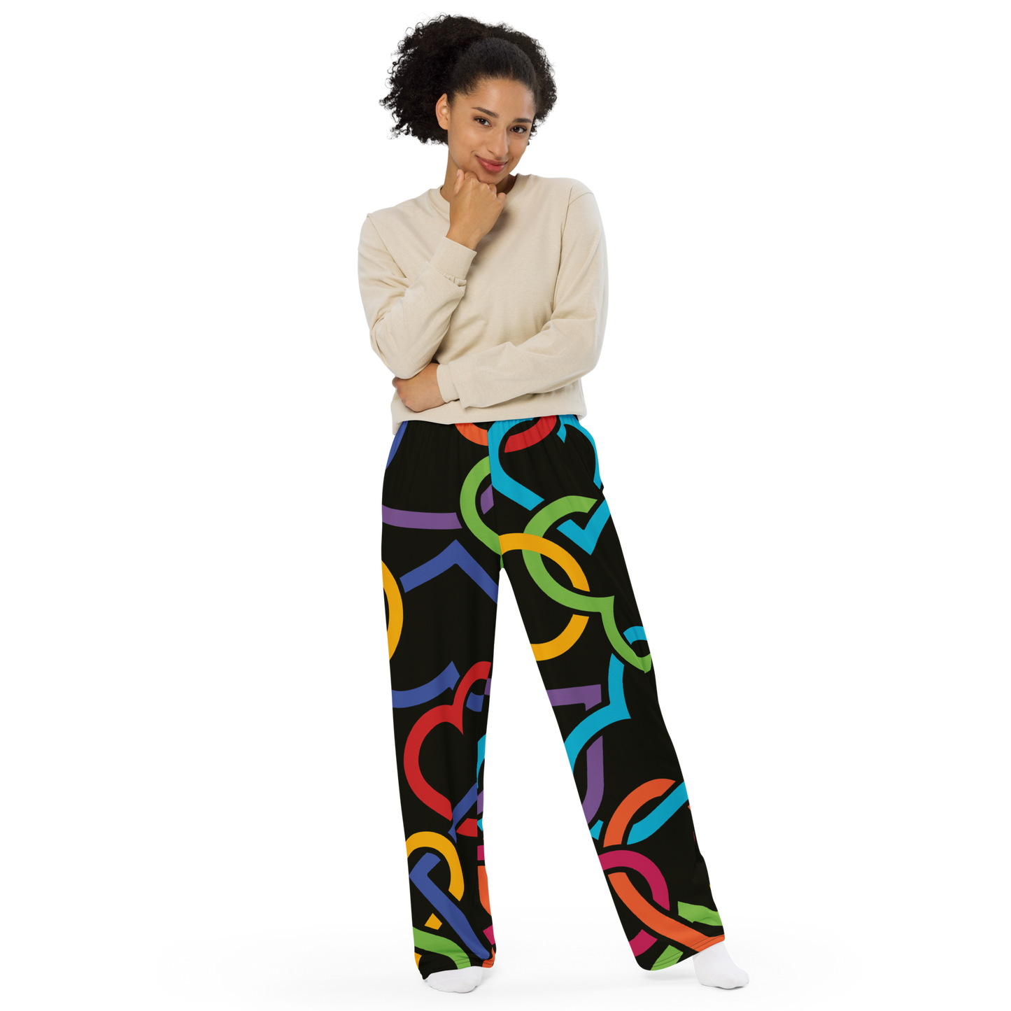 Wide-leg pants with multicolored heart outlines on a black background.