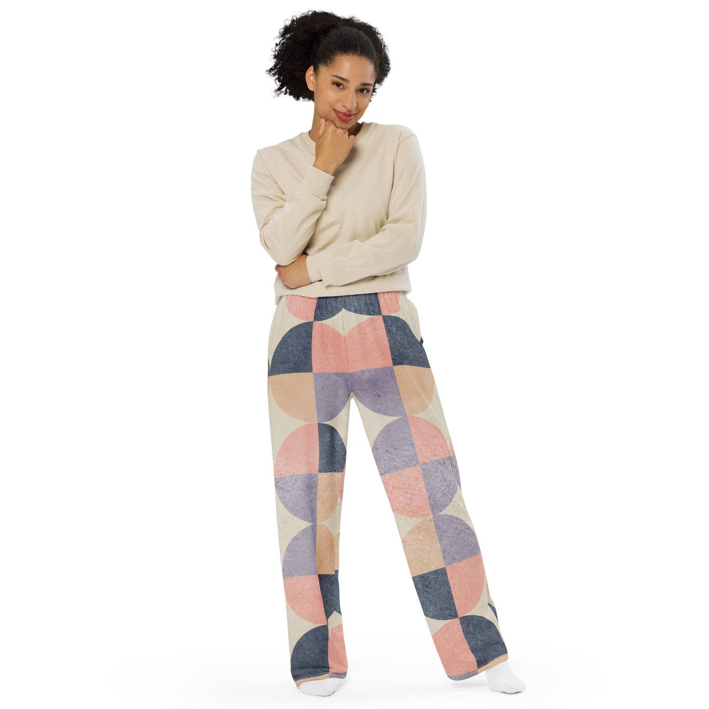 Wide-leg pants feature arched shapes in blush, blue, and beige pattern.