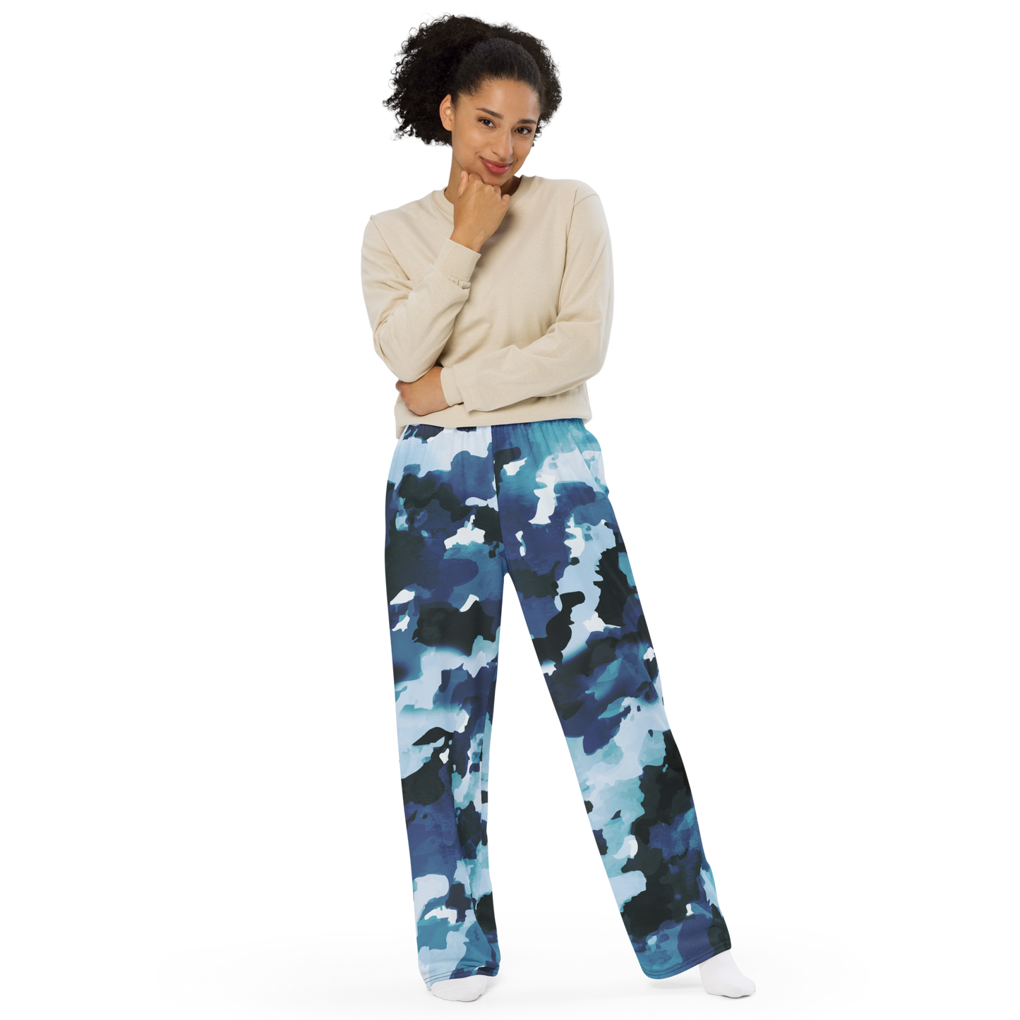 Wide-leg pants with abstract blue teal and white painterly pattern design.