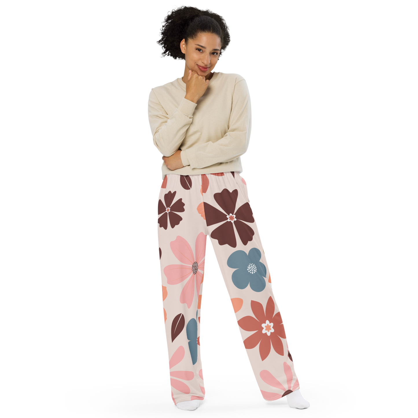 Wide-leg pants with oversized floral pattern in pink, brown, coral and blue.