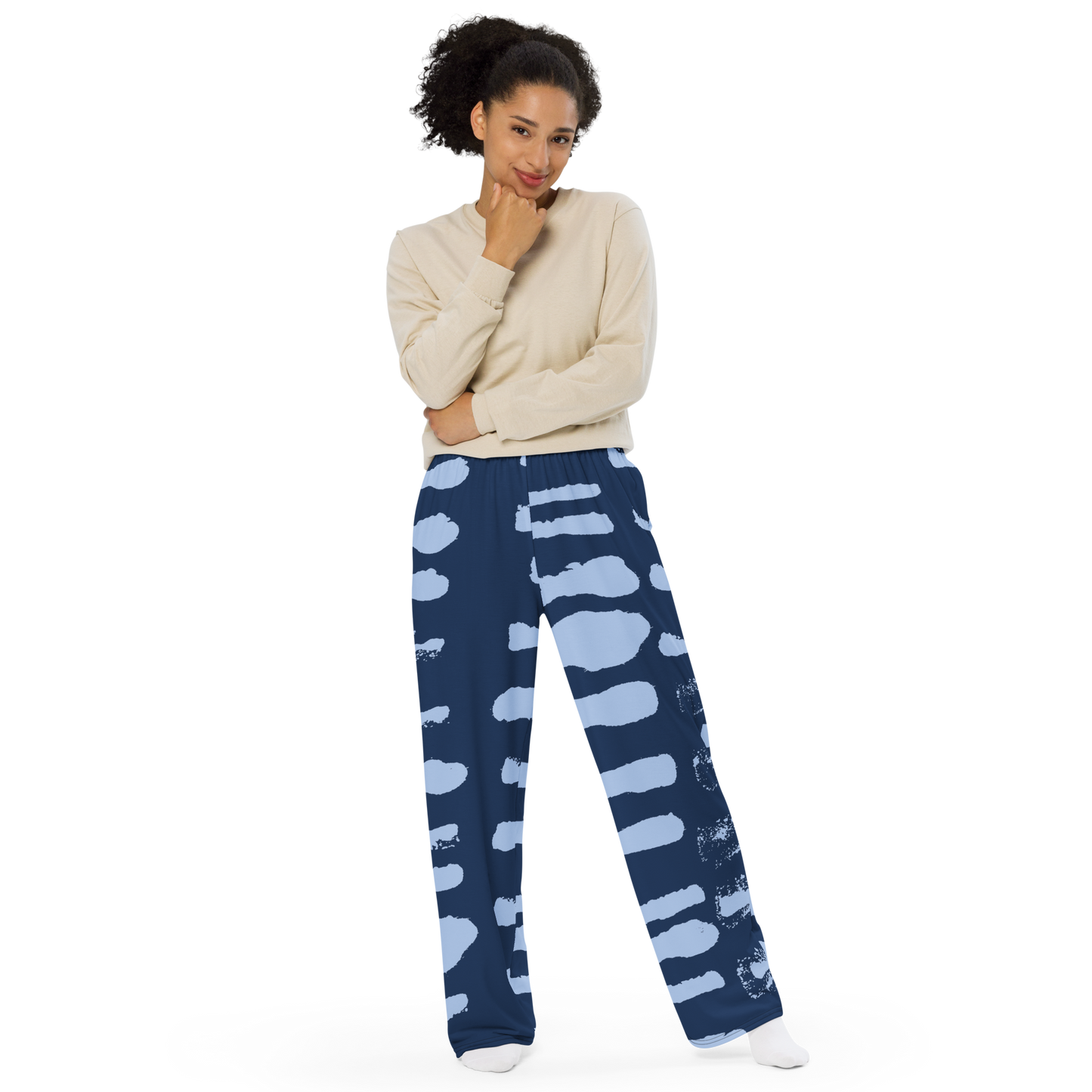 Navy wide-leg pants with blue painterly brushstroke pattern and elastic waistband.
