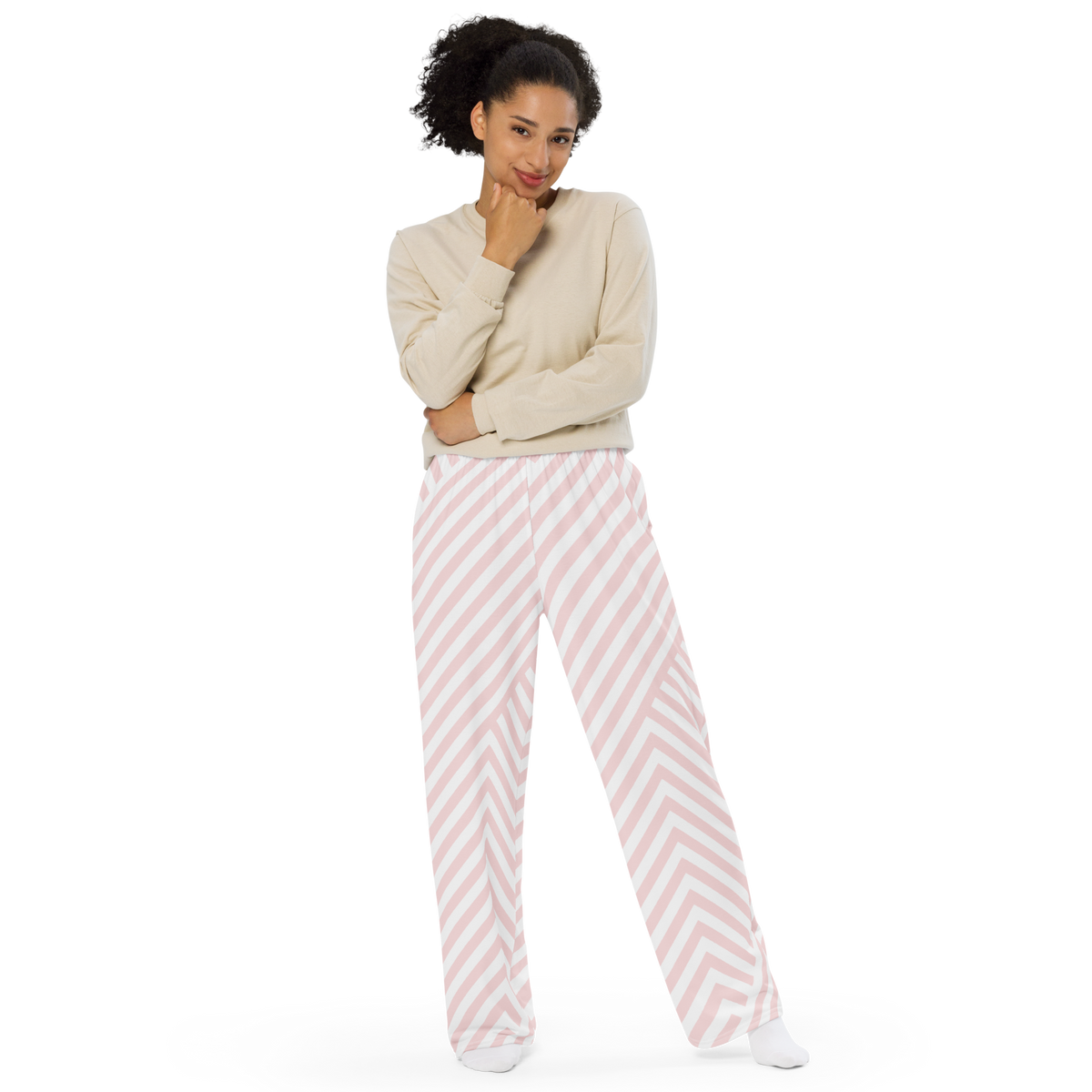 Wide-leg pants with soft pink and white chevron stripes and elastic waistband.
