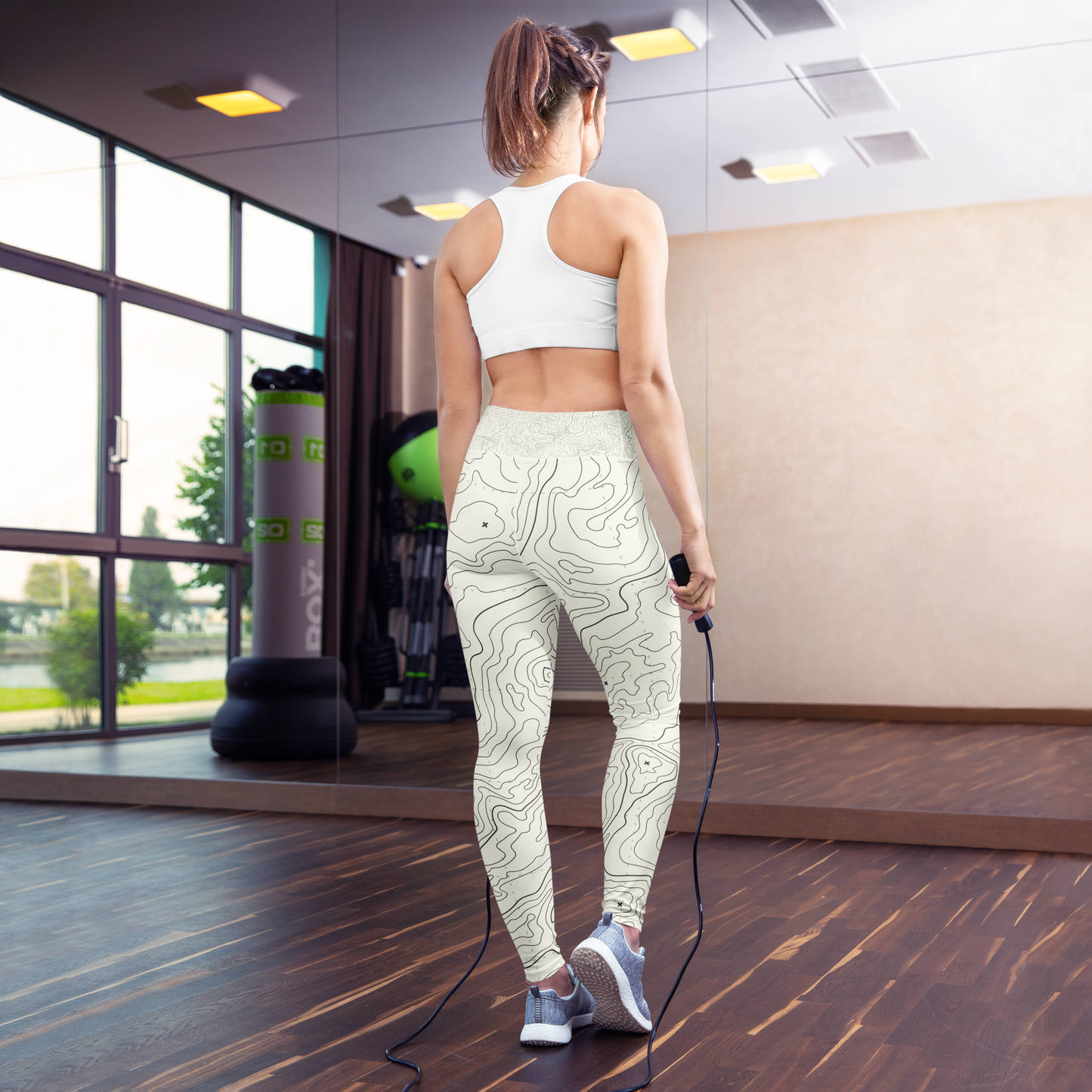 White leggings with topographic map pattern in contrasting lines.